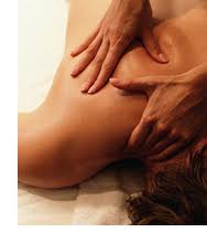 Massage therapist in Fond du Lac providing therapeutic deep tissue massage for back pain relief